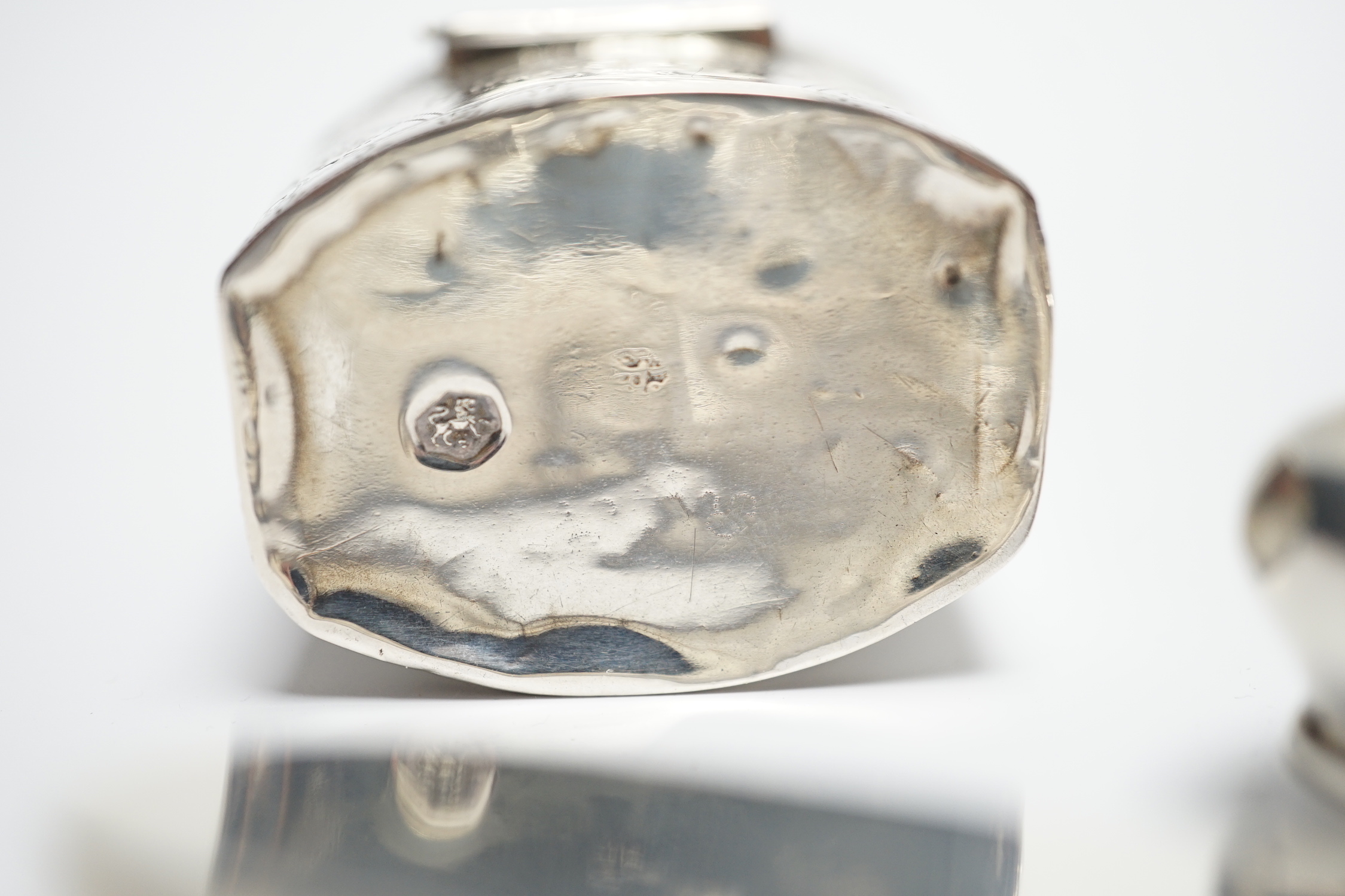 A late Victorian silver pill box with Reynold's Angel decorated cover, 47mm, a modern silver pill box and a Dutch white metal box.